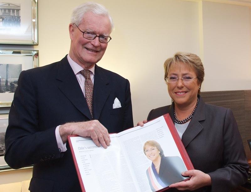 Rt Hon Lord Hurd of Westwell CH CBE PC presents a leather-bound copy of the Official Chile report to HE Michelle Bachelet, President of the Republic of Chile