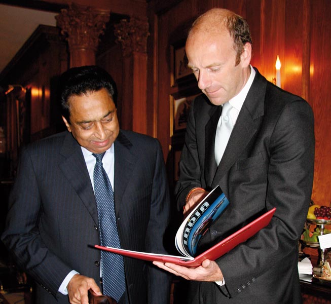  	 Rupert Goodman, Chairman and Founder of FIRST presents a leather-bound copy of the Special India report to Kamal Nath
