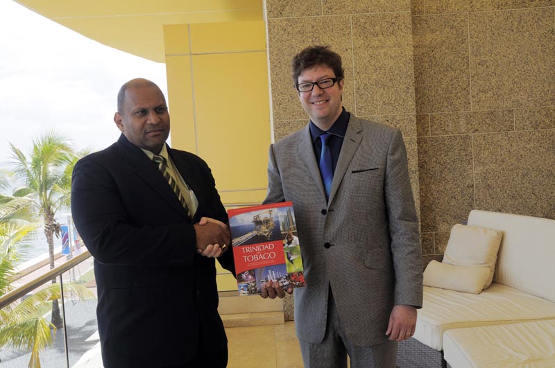 FIRST Executive Publisher Alastair Harris presents a copy of the Official Centenary book on Trinidad and Tobago’s petroleum industry to T&T’s Minister of Energy & Energy Industries Senator The Hon Conrad Enill