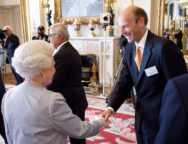 Rupert Goodman, Chairman and Founder of FIRST with HM Queen Elizabeth II at the Queen's Award Ceremony, Buckingham Palace