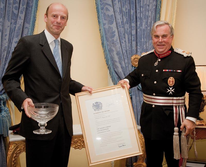 Rupert Goodman, Chairman and Founder of FIRST receives the Queen's Award Certificate from Sir David Brewer MG JP, Her Majesty's Lord-Lieutenant of Greater London